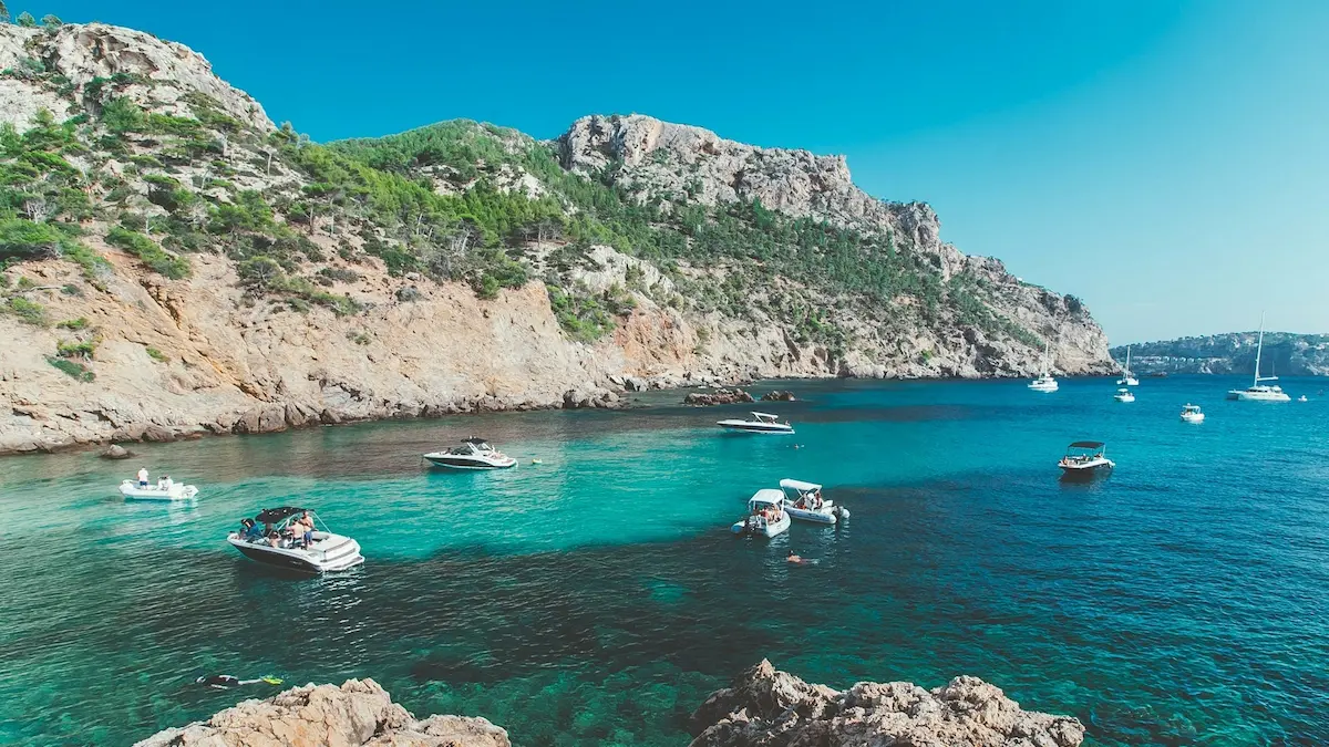 Crystal clear azure water in a protected rocky cove (cala) in Mallorca, a highlights of a Mallorca yacht charter