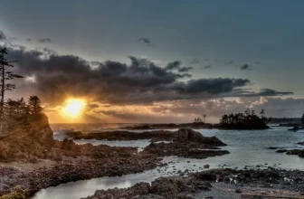 Rocky shore and sunset over the Wild Pacific Trail at Ucluelet, British Columbia