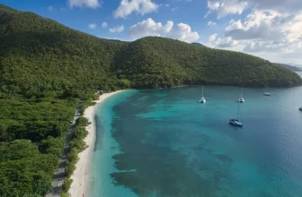Aerial view of turquoise bay, sandy beach and anchored sailboats at St. John, USVI