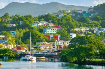 Colorful hillside homes overlooking the Castries harbor in Saint Lucia with yachts anchored in calm tropical waters.