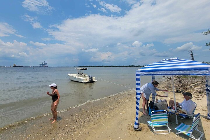 Guests enjoying lunch with the optional beach cabana setup - 3 hour Private Afternoon Boat Ride and Beach Excursion