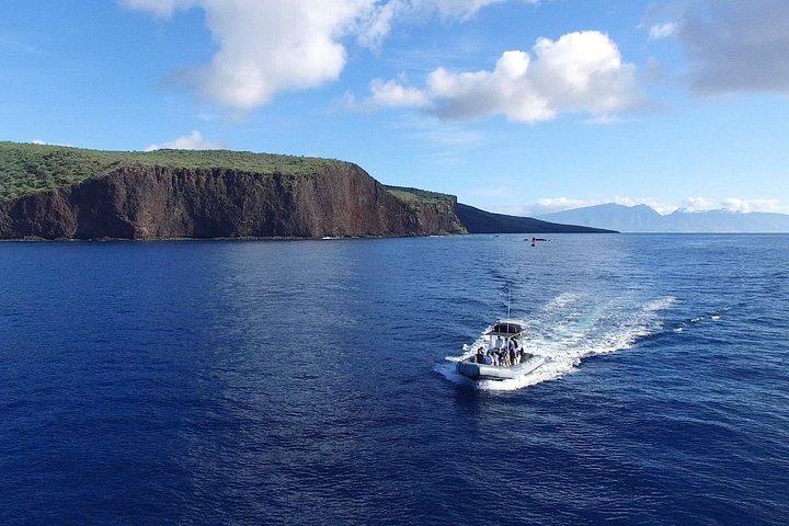 Cruising along Lanai's coast in our small group adventure vessels! - Lanai Eco-Raft Snorkel & Dolphin Watch Small Group Tour from Maui
