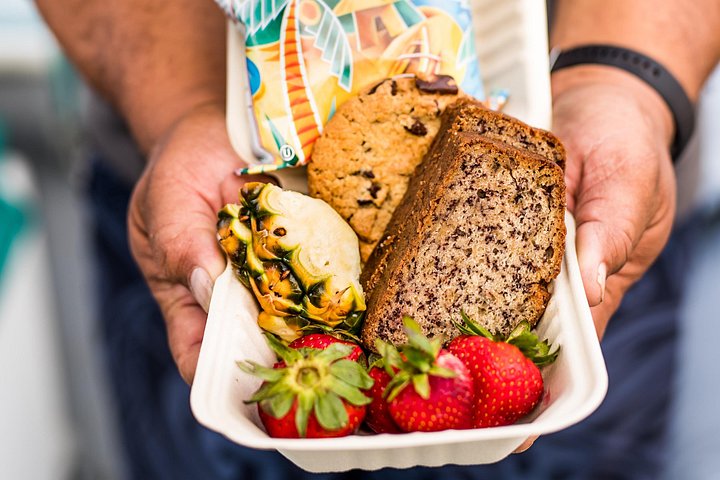 Breakfast and snacks and beverages are served on our snorkel tours. Banana bread, passionfruit cream cheese, fresh fruit, Maui style chips and cookies! - Lanai Eco-Raft Snorkel & Dolphin Watch Small Group Tour from Maui