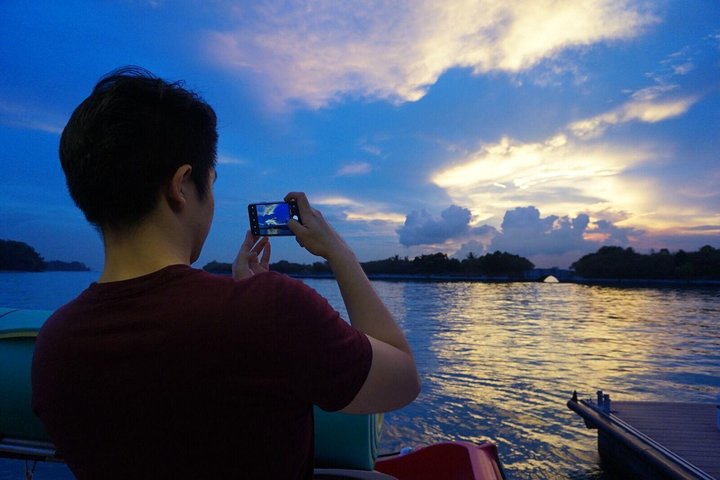 Be amazed with the beautiful sunset - Singapore Sunset and Morning Cruise On A Luxury Catamaran