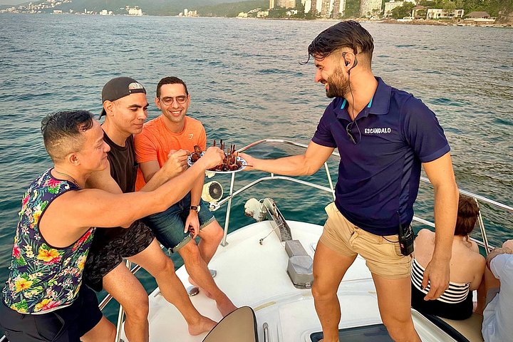 Our friendly crew serving appetizers and drinks as guests relax and enjoy the cruise. - Puerto Vallarta: Luxury Yacht Sunset Cruise with Premium Open Bar